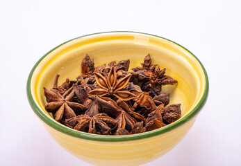 Star anise in a vintage ceramic bowl