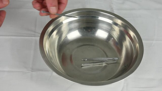 hands of a coroner medical utensils after autopsy possibly died of covid-19