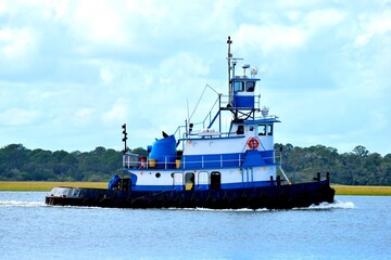 Tugboat cruising on the river at St. Augustine, Florida