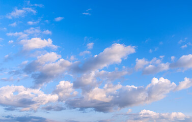 Beautiful picturesque sky with with snow-white clouds and beautiful  lighting.