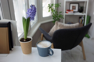 Hyacinth and a cup of coffee on the desk