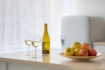 Wine and fruit for party and date in modern simple kitchen interior
