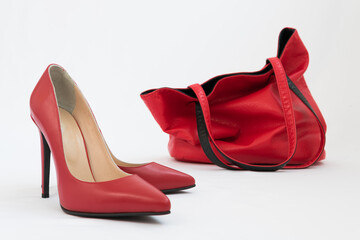 Beautiful women's high-heeled shoes. Large red leather bag. Defiant sexy style. Beautiful female accessories