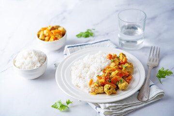 Curry chicken with rice in a plate