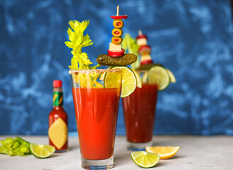 Bloody Mary cocktail, two glasses on a blue background
