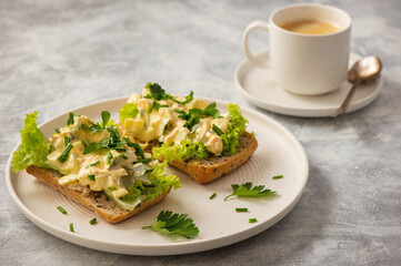 Egg salad sandwiches, on light background.