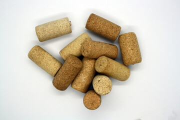 Corks from wine bottles on a white background.