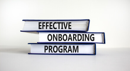Effective onboarding program symbol. Books with words 'effective onboarding program' on beautiful white background. Business and effective onboarding program concept. Copy space.