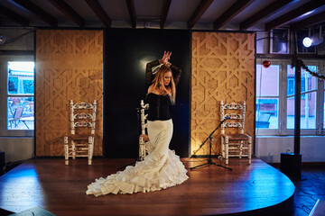 Spanish flamenco dancer on a traditional stage.
