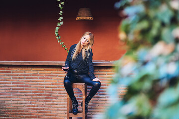 Woman having a wine on a terrace