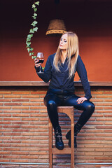 Woman having a wine on a terrace