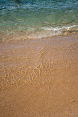 Fototapeta na wymiar Sea sandy beach and waves
