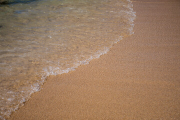 Sea sandy beach and waves