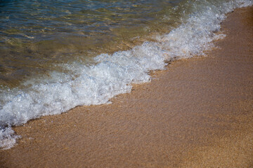 Sea sandy beach and waves