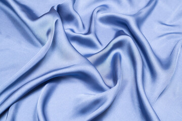 Obraz premium Blue silk or satin luxury fabric texture. Top view.