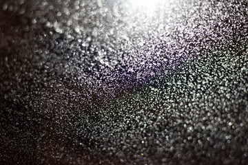 Blurred background with raindrops and lights.