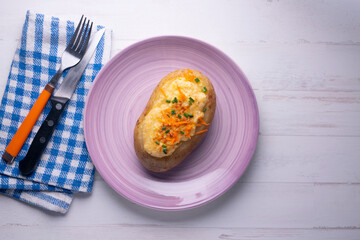 Stuffed grilled potatoes with bechamel and cheese