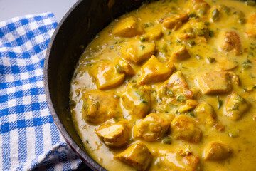 Chicken cooked with coconut milk and curry.