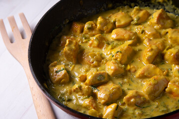 Chicken cooked with coconut milk and curry.