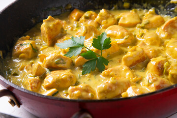 Chicken cooked with coconut milk and curry.