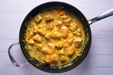 Chicken cooked with coconut milk and curry.