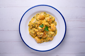 Chicken cooked with coconut milk and curry.
