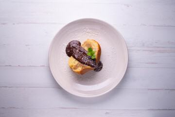 Coffee cake traditional spanish recipe with chocolate on the top.