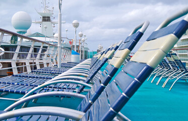 Pooldeck or swimmingpool with outdoor sun deck on modern classic cruiseship or cruise ship liner...