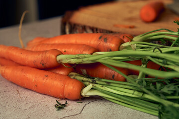 bunch of clean young carrots with tops