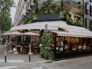 Boulevard San-German with tables of cafe in Paris, France. Architecture and landmarks of Paris. Postcard of Paris
