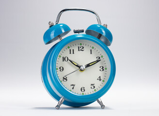 blue alarm clock isolated on white background