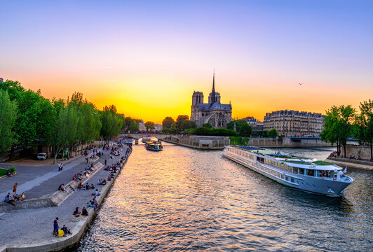 Sunset view of Cathedral Notre Dame de Paris, island Cite and river Seine in Paris, France