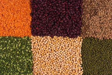 Legumes food background: red bean, red lentlis, green lentlis, mung bean, yellow peas and green peas.
