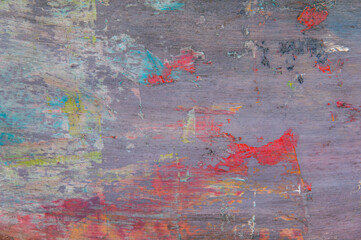 colorful creative motley background: smudged residues of oil paints on a wooden palette, short...
