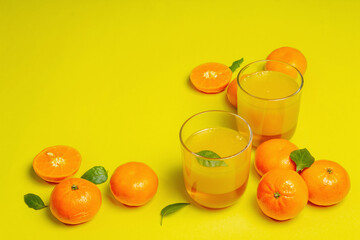 Sweet fruit jelly from fresh oranges and tangerines on summer yellow background