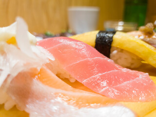 Fresh salmon sushi, tuna sushi close-up and egg sushi image