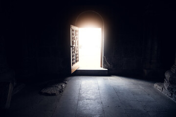 open dark church door and light