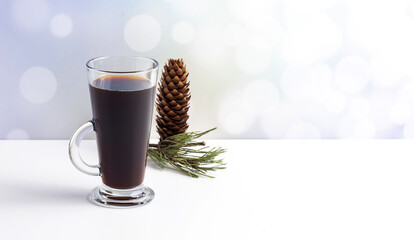 Hot coffe with marshmallows in transparent tall glass, isolated on white background.