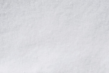 Background, texture of winter white fresh snow. Photo, top view.