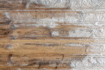 winter frosty background: boards covered with snowflakes and hoarfrost, ice patterns, wood texture, close, toning
