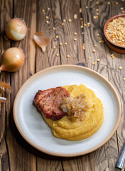 Czech cuisine, smoked meat with pea porridge and fried onion until golden