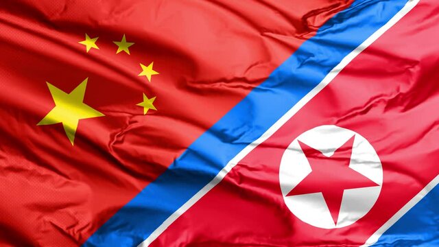 A Chinese and North Korea waving flag