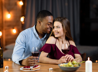 Interracial Love. Portrait Of Happy Multicultural Couple On Romantic Date In Restaurant