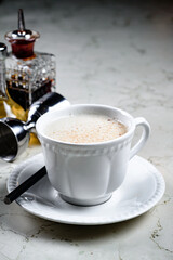 Alcoholic coffee cocktail with coffee liqueur and milk, alcoholic cocktail in a cappuccino coffee mug. Coffee with Irish whiskey and whipped cream