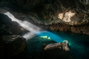Grjotagja volcanic cave with an incredibly blue and hot thermal water near lake Myvatn. The...