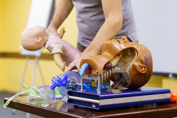 Detail of a training dummy for intubation. Head of medical doll ready for a training. Healthcare and education concept.