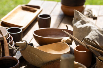 wooden and earthenware are on the table after eating