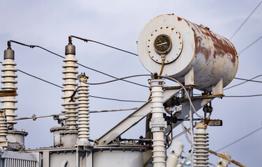 close up of Transformer oil tank on High voltage obsolete vintage electrical substation. Closeup on...