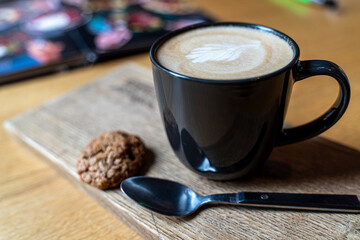 Beautiful cappuccino with a pattern of thick milk foam - the work of a professional barista