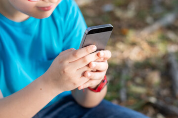 selective approach child's hands using a mobile